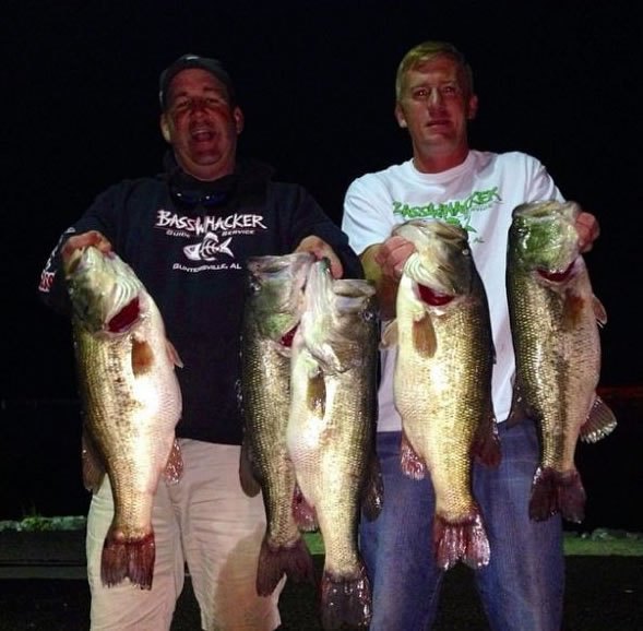 Photo of the two men holding a big catch (Courtesy: Wired2Fish.com, from one of the men’s Facebook pages)