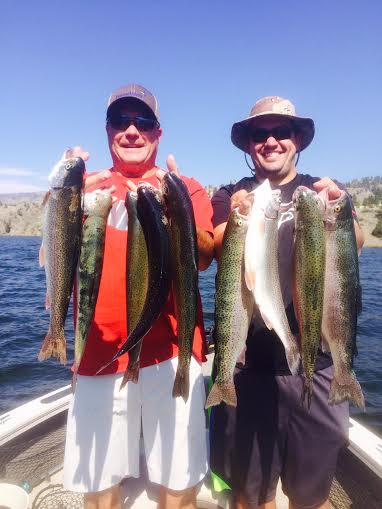 Dave Montelius and John Hermes hold up some Holter lake trout.