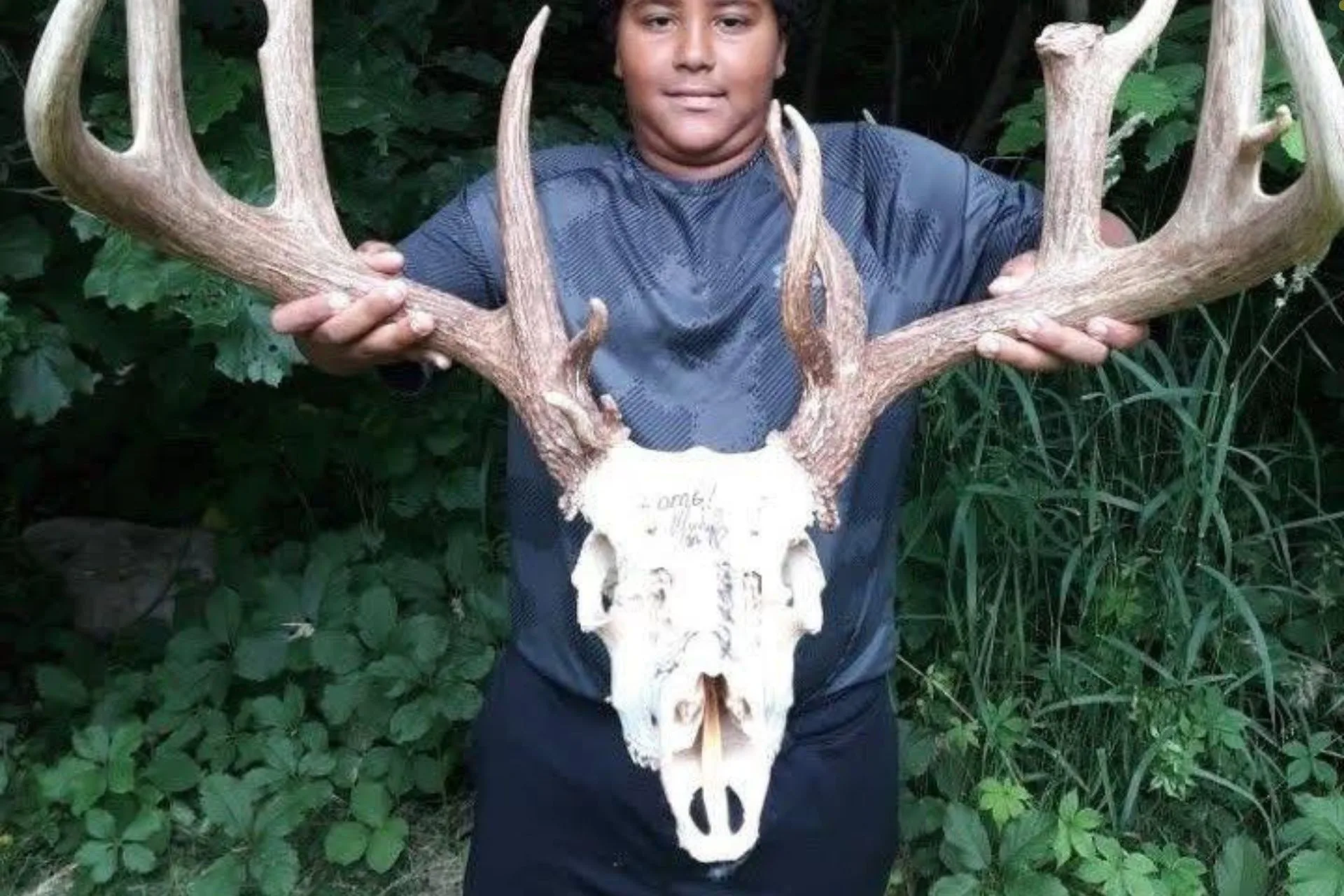 Youngster Poses with Massive 4×4 Mainframe Buck Skull Scoring 201″ Gross