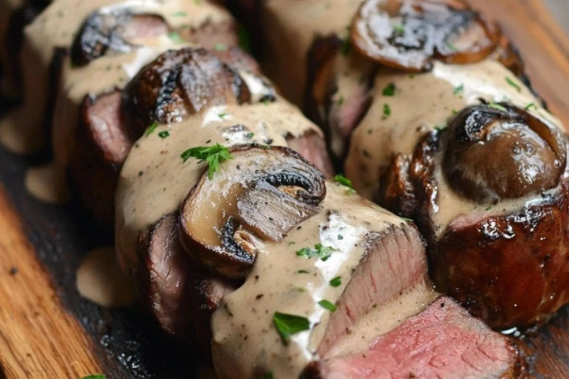 Bacon-Wrapped Venison Backstrap with Mushroom Cream Sauce