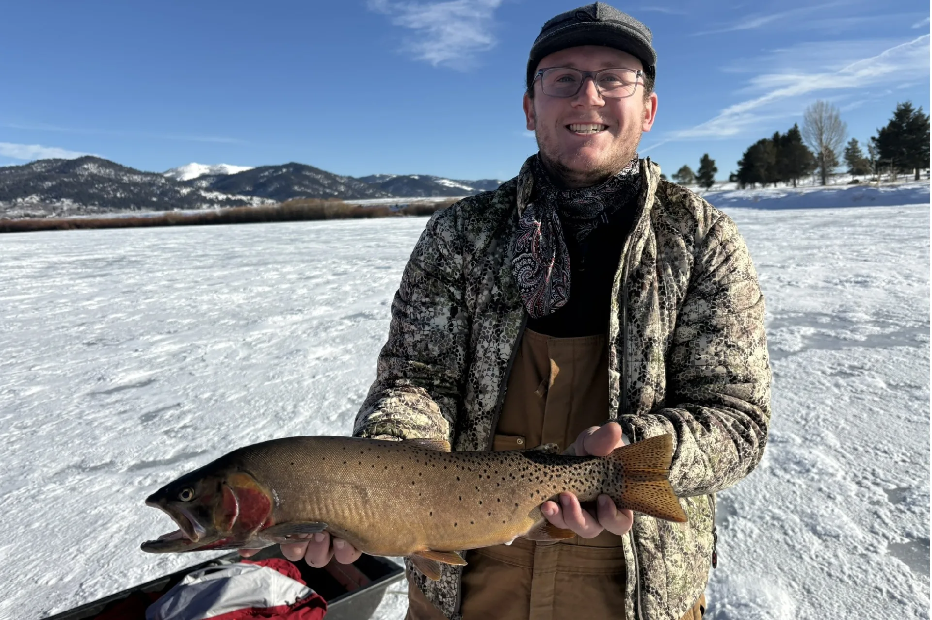New state record trout hoisted out of ice